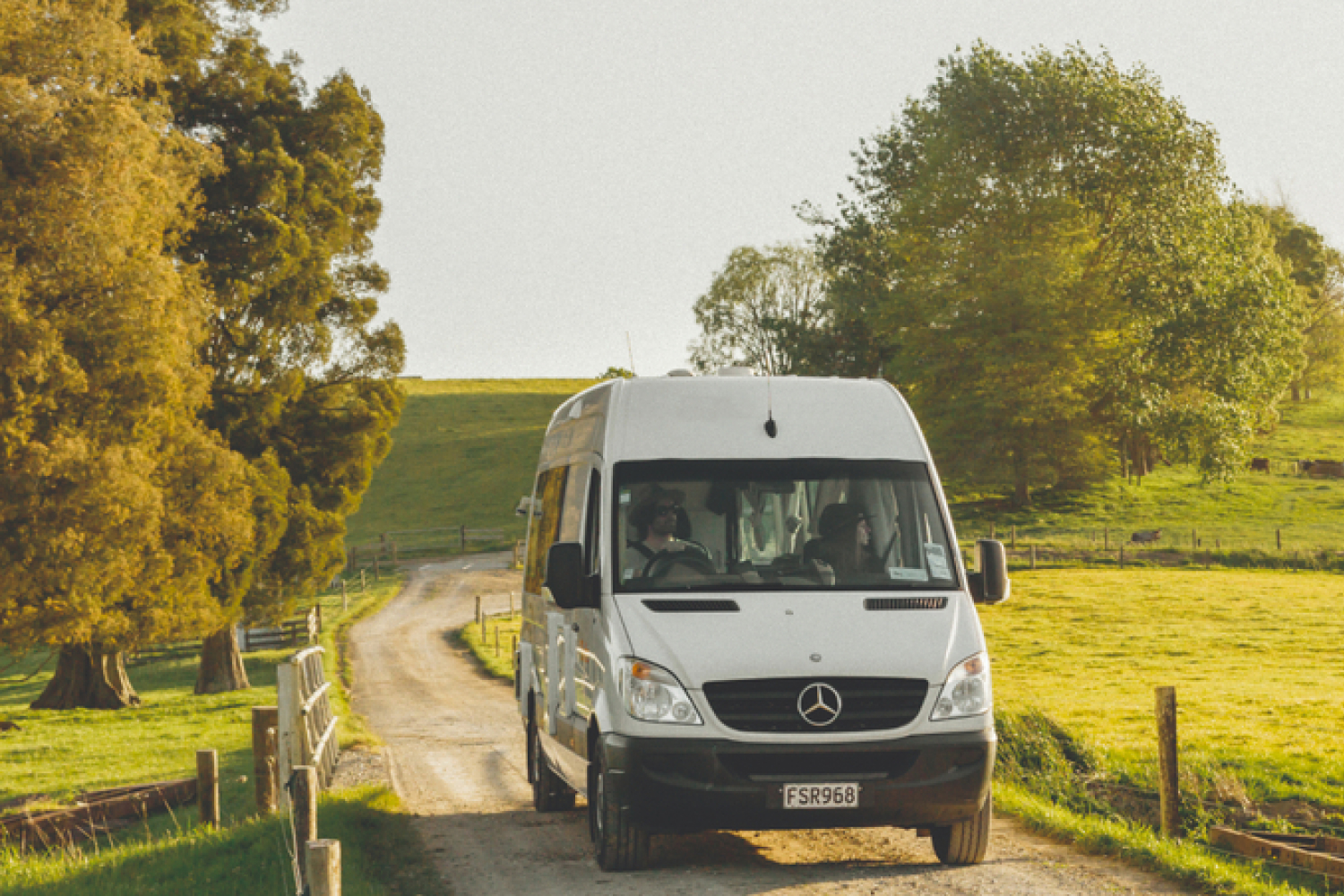  motorhome driving in sunset