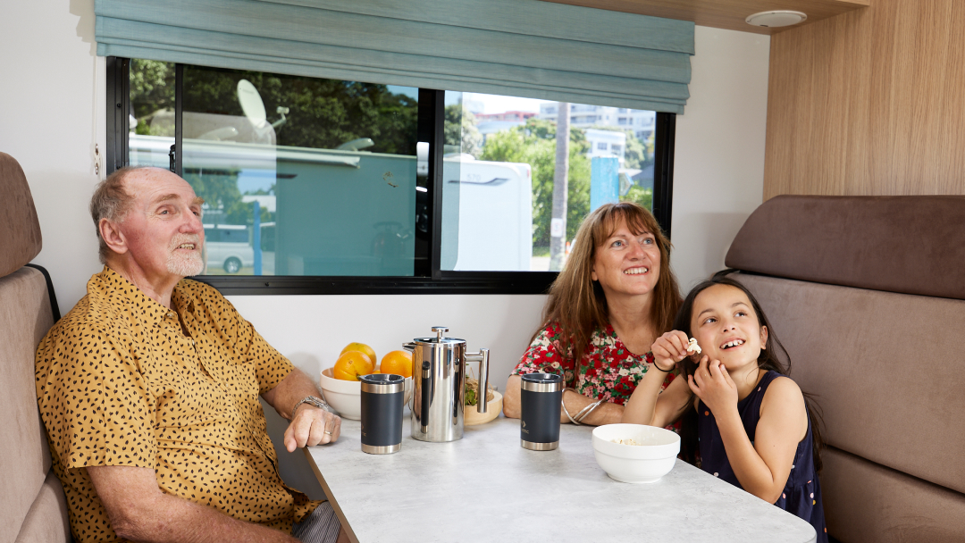 KEA motorhomes watching TV inside with grandparents