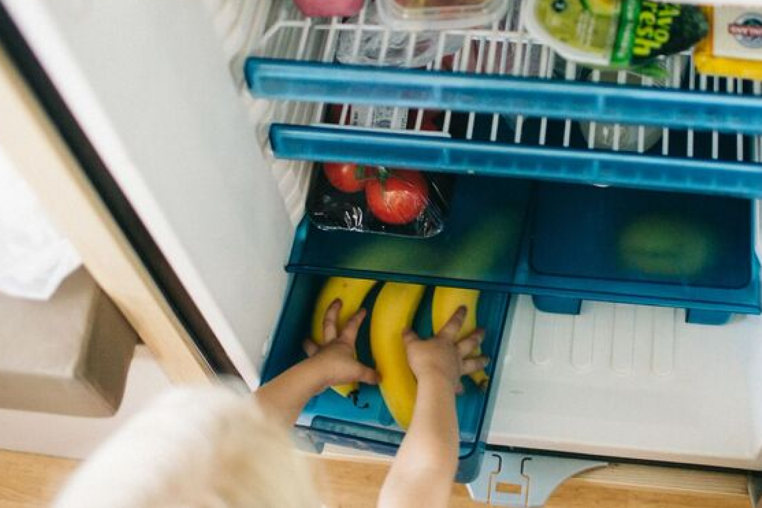 reaching into RV fridge