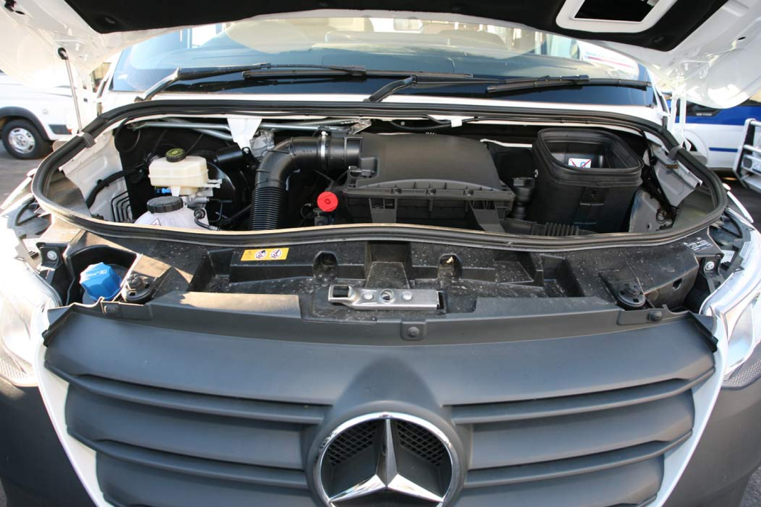 Motorhome engine with popped hood