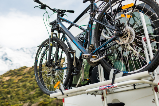 bike rack on the back of a motorhome with bike attached