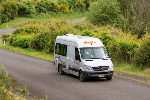  Britz motorhome of road with lots of greenery in surroundings